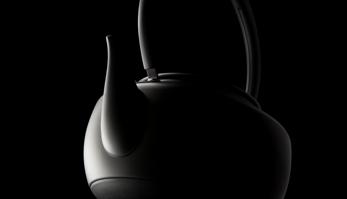 An artistic silhouette of a MoonKettle, with precise lighting emphasizing its smooth curves and elegant form.