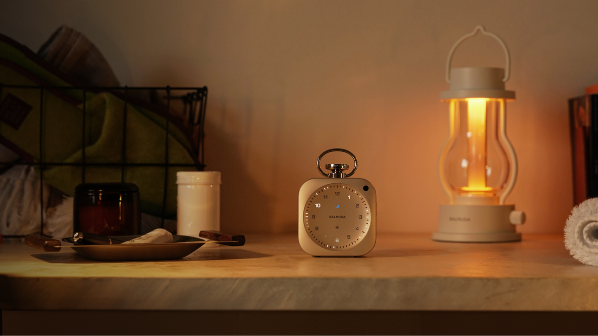 The Clock and the lantern on the counter in warm ambient light