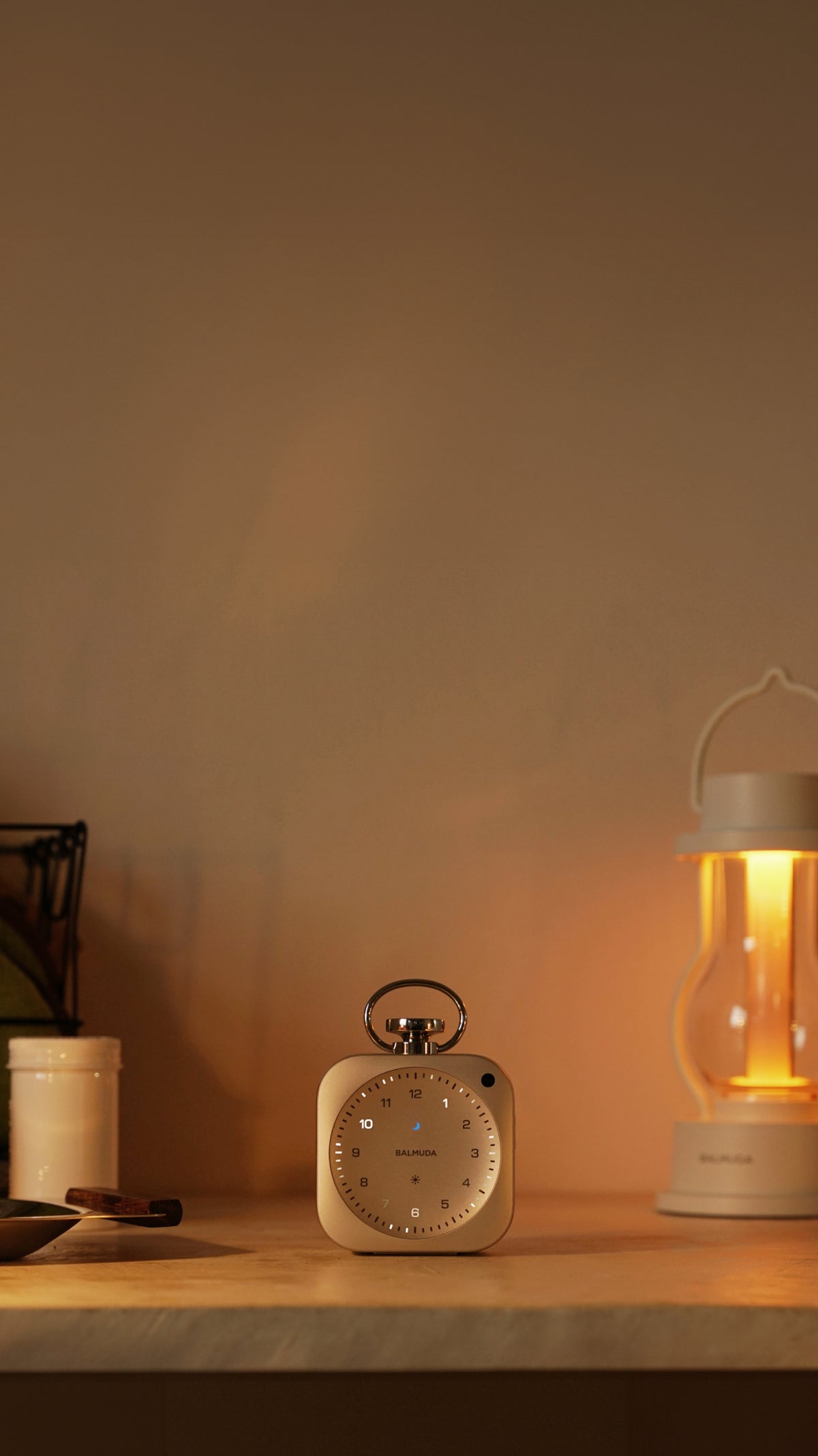 The Clock and the lantern in warm ambient light