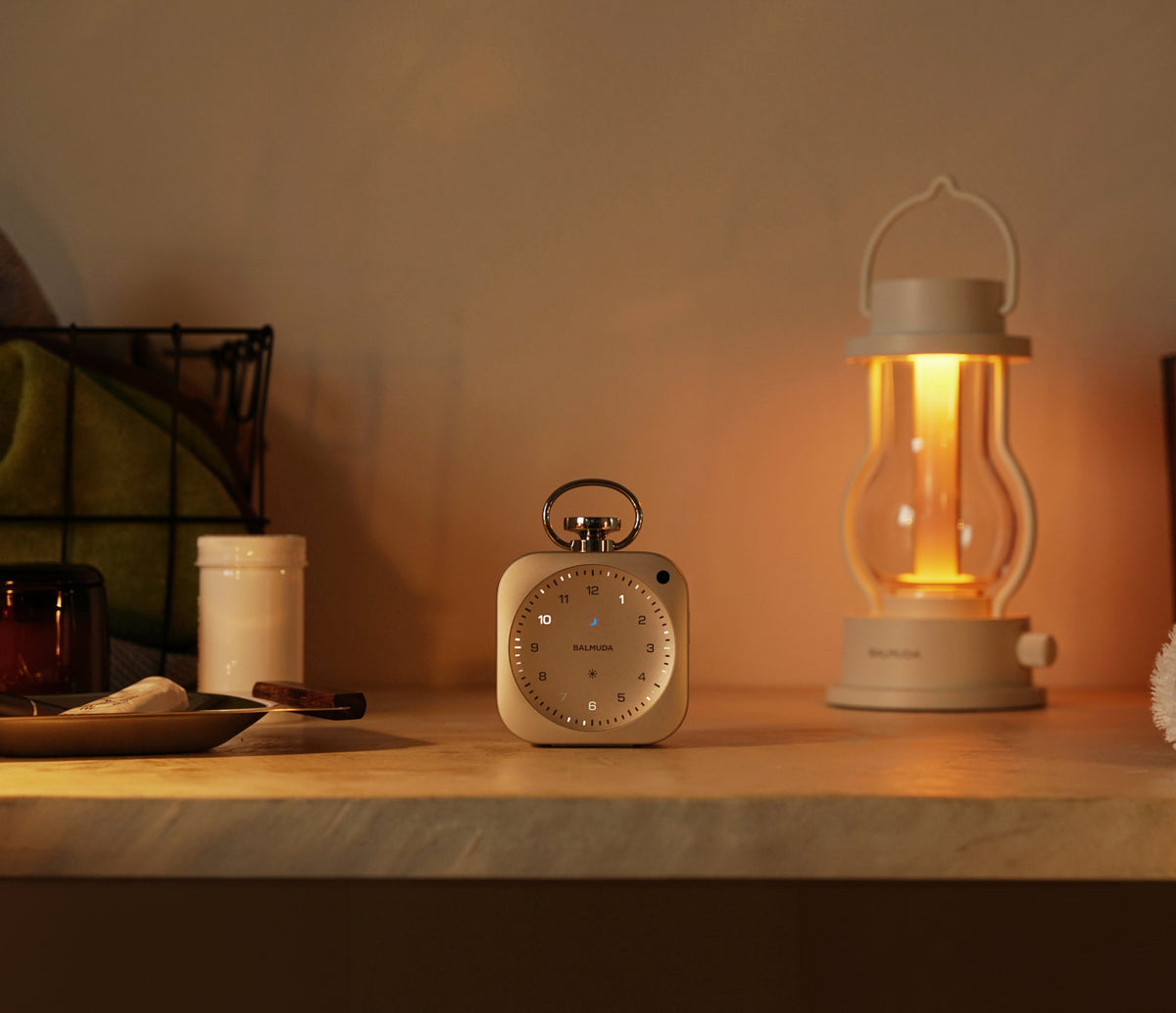 The Clock and the white lantern on the counter
